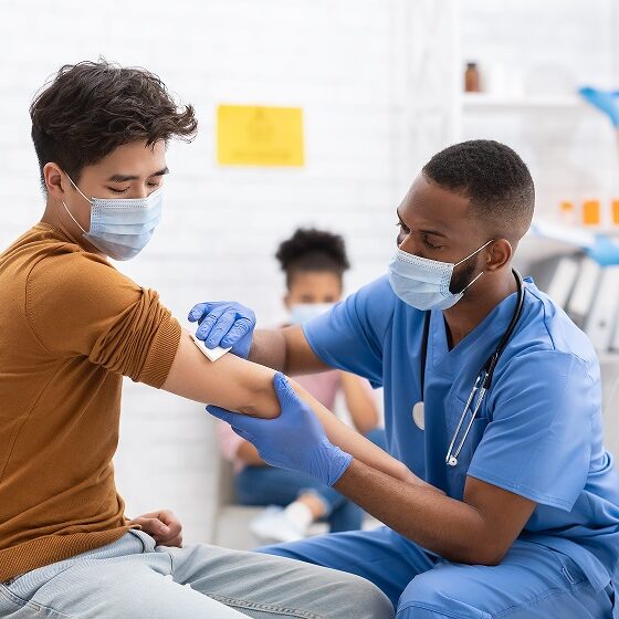 Covid-19,Vaccination.,Asian,Male,Patient,Getting,Vaccinated,Against,Coronavirus,Receiving