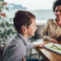 Smiling,Deaf,Boy,Learning,Sign,Language